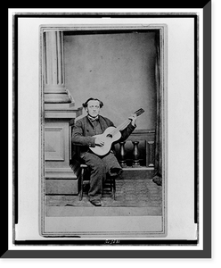 Civil War soldier, with one leg, full-length portrait, seated, facing front, holding guitar, Vintage Poster