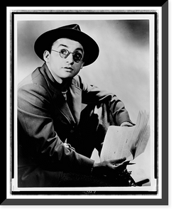 Arch Oboler, half-length portrait, seated, facing right, wearing hat and glasses, holding paper and pencil, Antique Wall Art