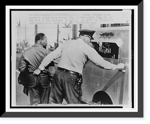 Police officer seizing Dr. Martin Luther King by the seat of his trousers and leading him to a paddy wagon, after anti-segregation march in Birmingham, Ala. Classic, Vintage Print