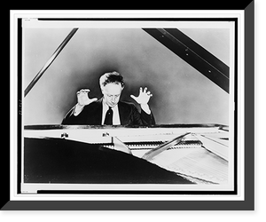 Historic Framed Print, [Artur Rubinstein seated at a grand piano, with his hands raised],  17-7/8" x 21-7/8"