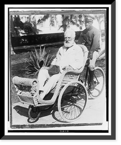 Alexander Graham Bell, seated in a wicker wheeled chair, Vintage Poster