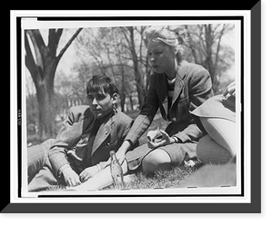 Historic Framed Print, [FSA staff members John Collier, reclining, and Jean Lee, eating an apple, taking a break out-of-doors],  17-7/8" x 21-7/8"
