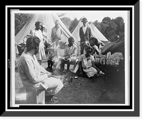 African Americans in front of tents, with woman working on girl's hair, during a Mississippi River flood, Vicksburg National Military Park, Antique Poster