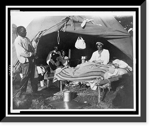 African Americans in front of tent, with one man sitting up on bed, during a Mississippi River flood, Vicksburg National Military Park, Antique Print