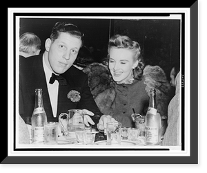 Alfred Bloomingdale seated at table with Barbara Bradford at the Kit Kat Club Classic, Vintage Poster