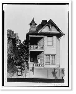 Historic Architecture - African American man standing on porch of house