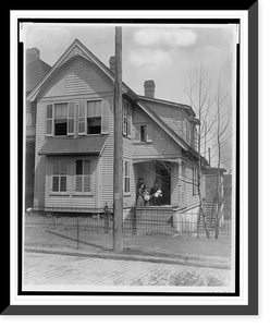 African American family posed on porch of house, Historic Print