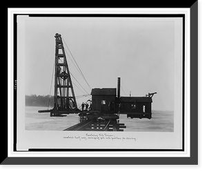 Revolving pile driver; revolved half-way, swinging pile into position for driving, Vintage Print