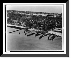 Aerial view of Edgewater, N.J., showing docks on Hudson River, city and amusement park on cliff, Antique Poster