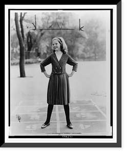A pre-teen girl modeling a Chanel look" sweater and skirt outfit on a playground", Vintage Print