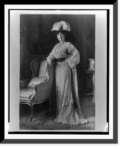 Historic Framed Print, [Evalyn Walsh McLean, full-length portrait, standing, facing front with right arm resting on back of chair],  17-7/8" x 21-7/8"