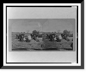 Group of Winnebego Indians seated on ground and logs, Historic Print