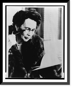 Adela Rogers St. Johns, half-length portrait, facing right, reading through a lorgnette, Vintage Poster