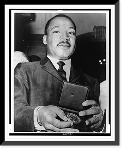 Historic Framed Print, Dr. Martin Luther King showing his medallion received from Mayor Wagner.World Telegram & Sun photo by Phil Stanziola.,  17-7/8" x 21-7/8"