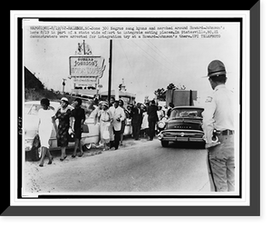 African Americans march outside a Howard Johnson's motor lodge in Raleigh, N.C. demonstrating for integration in eating establishments, Vintage Poster