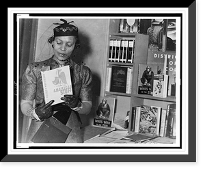 Zora Neale Hurston, half-length portrait, standing, facing front, looking at book, American Stuff, at New York Times Book Fair, Antique Wall Art
