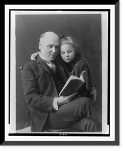 Howard Pyle, three-quarter length portrait, seated, facing slightly right, looking at book, and his daughter Phoebe with arm around his shoulders, Historic Print