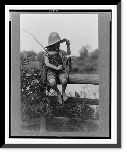 Reference prints from negatives.Doris Gottscho, holding fish and fishing pole, sitting on a fence III, Historic Reproduction