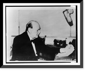 Historic Framed Print, [Sir Winston Churchill, half-length portrait, seated, facing right, making a wartime address over the radio],  17-7/8" x 21-7/8"