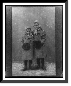 Anna and Sophie Freud, full-length portrait, standing, facing front, wearing coats and muffs.Dr. H. Heid, Wien, Vintage Print