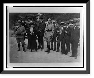 Charles E. Russell, third from right, standing with group of men, two wearing military uniforms, and one woman, Vintage Print