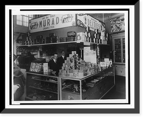 Interior of People's Drug Store, 7th and K Streets, Washington, D.C., with employees behind counter with display of smoking products including pipes, cigars, tobacco, and cigarettes Timeless Wall
