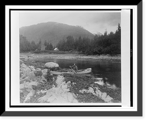 A man, possibly Lewis Rutherford Morris, seated in a canoe on a river in Alaska, 1899.Curtis, Antique Print