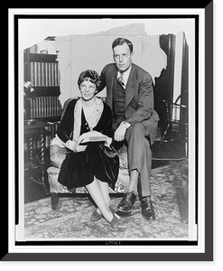 Historic Framed Print, [Amelia Earhart and husband George Palmer Putnam, full-length portrait, seated, facing front, in Mr. Putnam's New York office],  17-7/8" x 21-7/8"