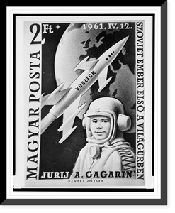 Historic Framed Print, [Hungarian postage stamp depicting Yuri Gagarin, Russian cosmonaut, head-and-shoulders portrait, facing slightly left, wearing space suit and helmet, with rocket and the earth in the background],  17-7/8" x 21-7/8"
