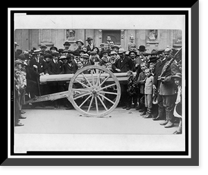 Historic Framed Print, [Crowd of German civilians, including children, surrounding a cannon which has a garland hanging from the muzzle],  17-7/8" x 21-7/8"