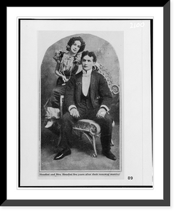 Historic Framed Print, [Beatrice and Harry Houdini, full-length portrait, seated, facing front],  17-7/8" x 21-7/8"