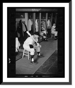 Historic Framed Print, [Mickey Mantle, New York Yankee baseball player, in uniform, sitting in locker room holding a bat].Marvin E. Newman.,  17-7/8" x 21-7/8"