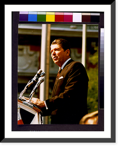 Historic Framed Print, [Ronald Reagan, half-length portrait, standing at microphones, facing left].photography by Marcia Dente. - 2,  17-7/8" x 21-7/8"