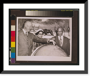 Matthew Henson shows President Eisenhower the location of the North Pole on a globe at the White House while his wife, Lucy Henson, watches - 2, Vintage Print