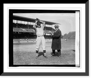 Historic Framed Print, Walter Johnson poses while U.S.J. Dunbar sketches him, [10/2/24],  17-7/8" x 21-7/8"