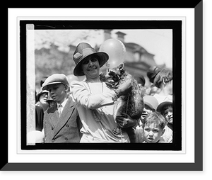 Historic Framed Print, Mrs. Coolidge & raccoon, Easter egg rolling, 4/18/27,  17-7/8" x 21-7/8"