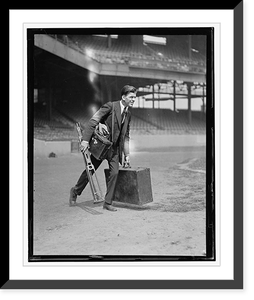 Man in suit carrying equipment cases in stadium - 2, Historic Reproduction