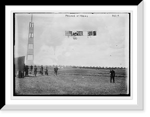 Historic Framed Print, Paulhan and flying machine in flight, Rheims,  17-7/8" x 21-7/8"