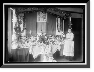Historic Framed Print, CROWN 'MOTHER' WITH EXHIBIT OF DOLLS,  17-7/8" x 21-7/8"