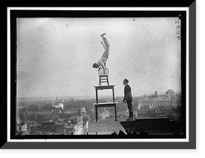 REYNOLDS, J., PERFORMING ACROBATIC AND BALANCING ACTS ON HIGH CORNICE ABOVE 9TH STREET, N.W. - 6, Antique Poster