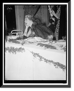 Mrs. E.B. McLean, with her Hope diamond and a armload of jewels seems to be deep in thought as to where her next load of diamonds are coming from Classic, Vintage Print