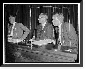 Listen to maritime troubles. Washington, D.C. Aug. 23. Chairman Joseph P. Kennedy, (left) and Commissioner Emory S. Land listen intently as maritime labor chiefs testify at the initial hearing of t