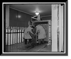 National Archives. Washington, D.C., Nov. 22. At the end of three hours the chamber is opened and the documents are ready for the next treatment, Vintage Poster