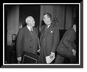 Historic Framed Print, In spotlight at NLRB investigation. Washington, D.C., Dec. 14. John P. Frey, left, President of the Metal Trades Union, A.F. of L., chats with Rep. Howard W.,  17-7/8" x 21-7/8"