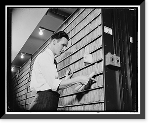 Patent Office employee pointing to copies of first patent granted after 1836 when patent laws were rewritten, Antique Wall Art