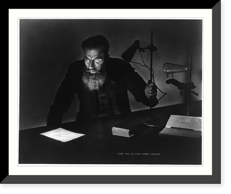 Wilhelm Konrad Roentgen, 1845-1923 (actor posing as Roentgen?); half, seated, experimenting with lamp Classic, Antique Poster