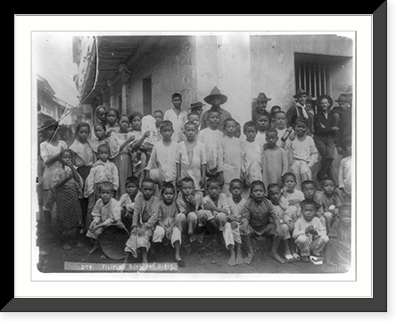 Historic Framed Print, [Philippine Insurrection, 1899: large group [?] of Filipino boys & girls, U.S. soldiers in background],  17-7/8" x 21-7/8"