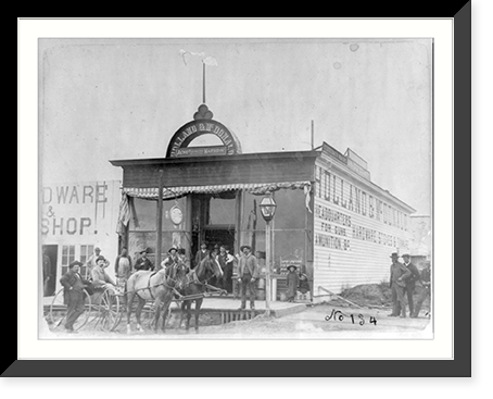 Group posed in front of the Holland & McDonald hardware store, Broken Bow, Nebraska, Historic Reproduction