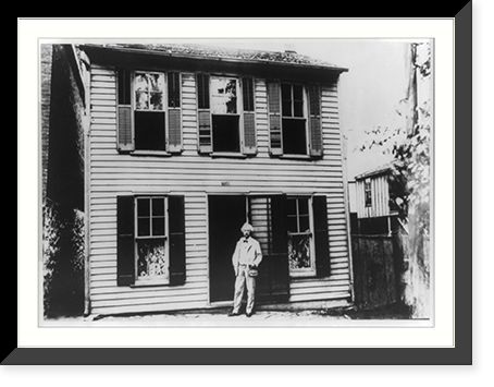 Mark Twain standing in doorway of his boyhood home on Hill Street, Hannibal, Missouri, Historic Reproduction