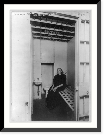 Historic Framed Print, [New York (City) Police Dept., 1909: Drunken woman" in new Tenderloin station cell,  showing cot,  toilet bowl,  and sink with running water]",  17-7/8" x 21-7/8"
